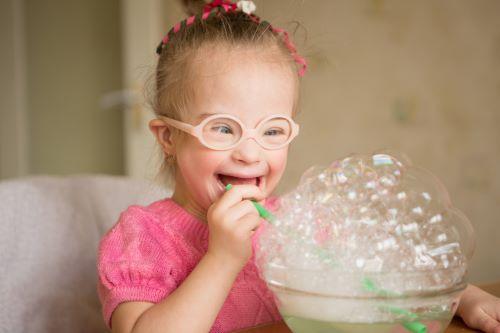 kid blowing bubbles | kids dentistry Dubuque, IA