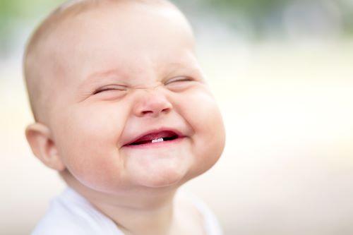 baby smiling after dental cleaning in dubuque, IA