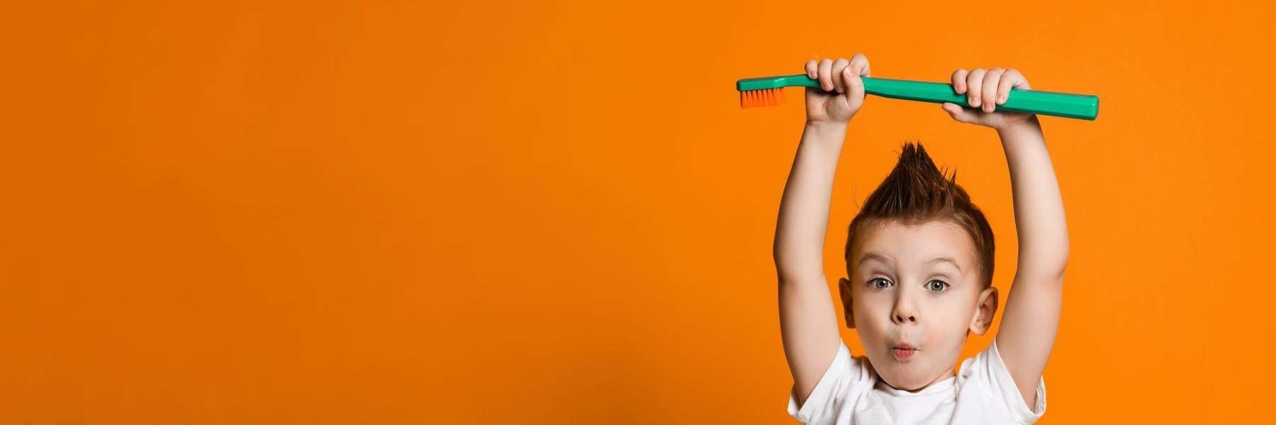 Kid with toothbrush in Dubuque, IA