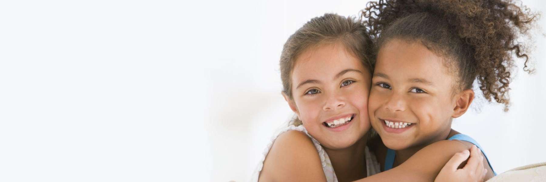 Kids smiling and hugging in Dubuque, IA